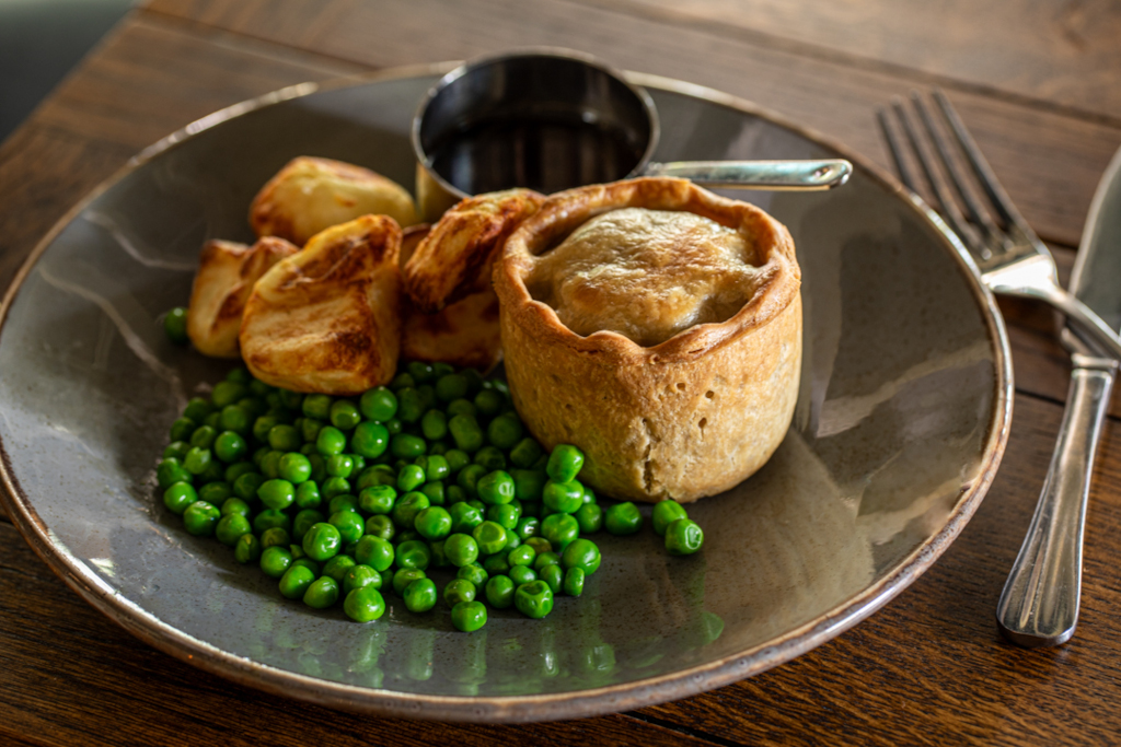 chicken and ham hock pie, garden peas and gravy